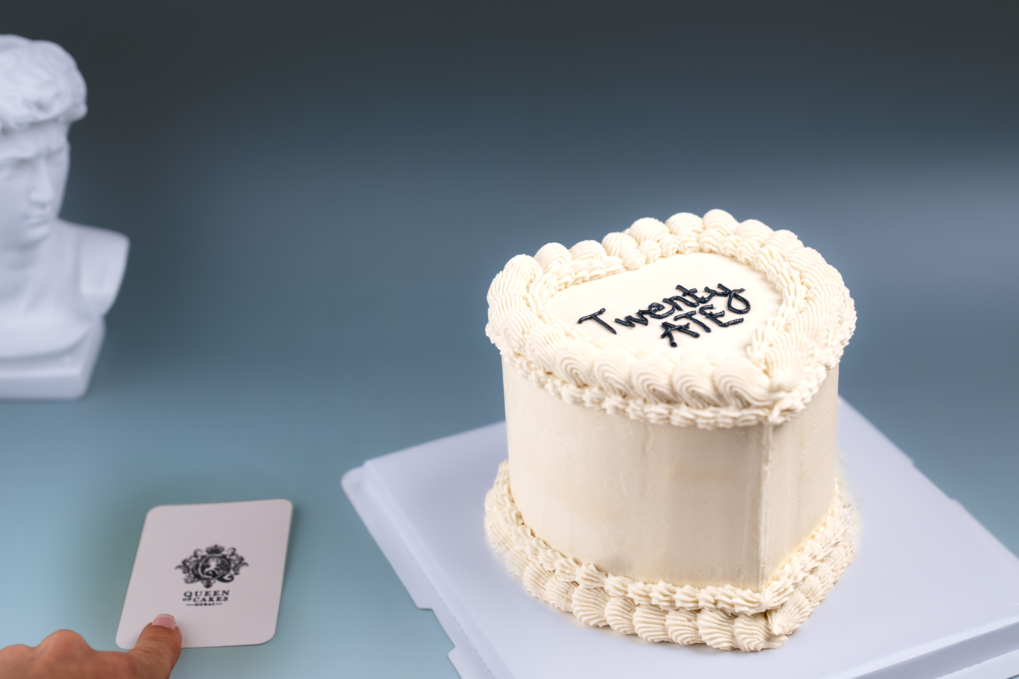 Ivory celebration cake with vintage piping