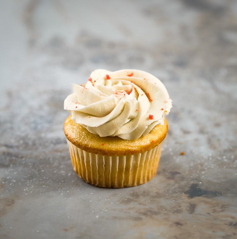 Vanilla bean cupcake with cream cheese swirl and a hint of red